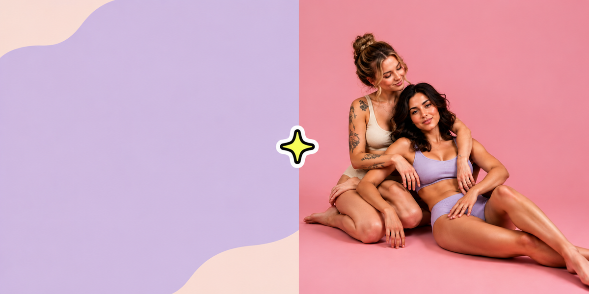 Two women embracing on a pink and lavender studio backdrop, inclusive intimacy lifestyle at HOTJIJI